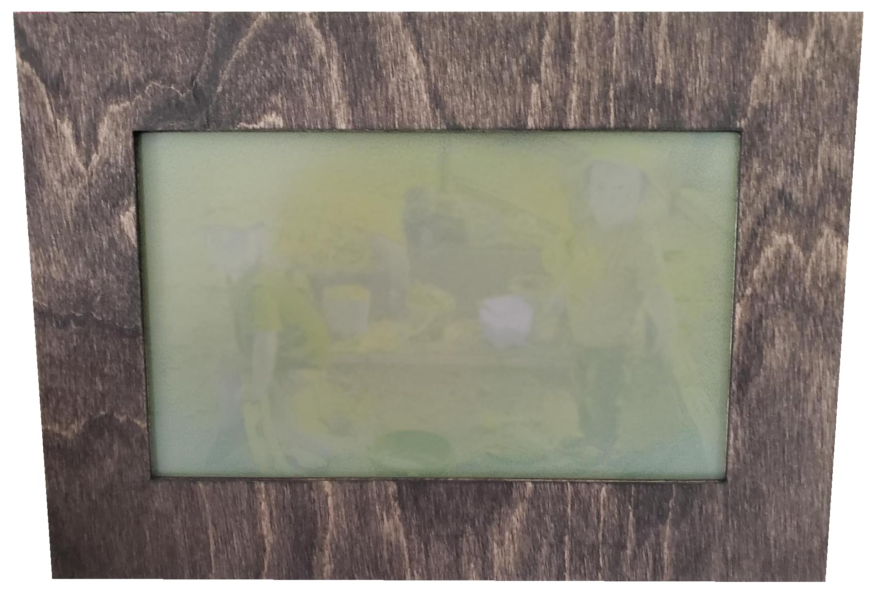 An e-ink digital photo frame with an image in transition