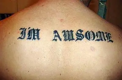 A tattoo on someone's back misspelt as I'm awsome