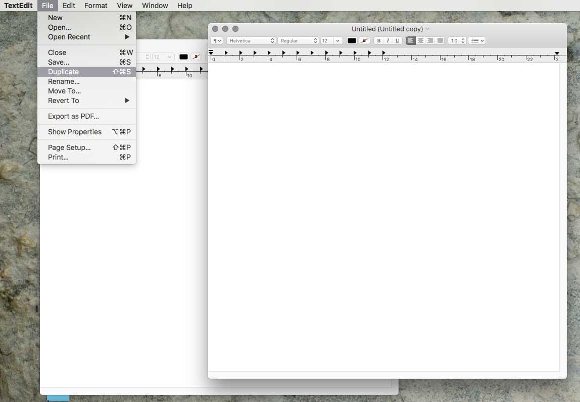 The Mac OS file menu open with the save and duplicate options showing