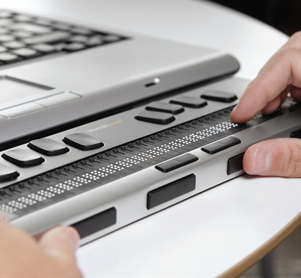A refreshable braille display in use